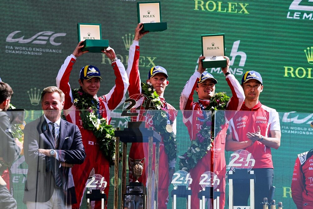 Toyota Racing number 7 drivers lift the 2026 Le Mans 24 Hours trophy
