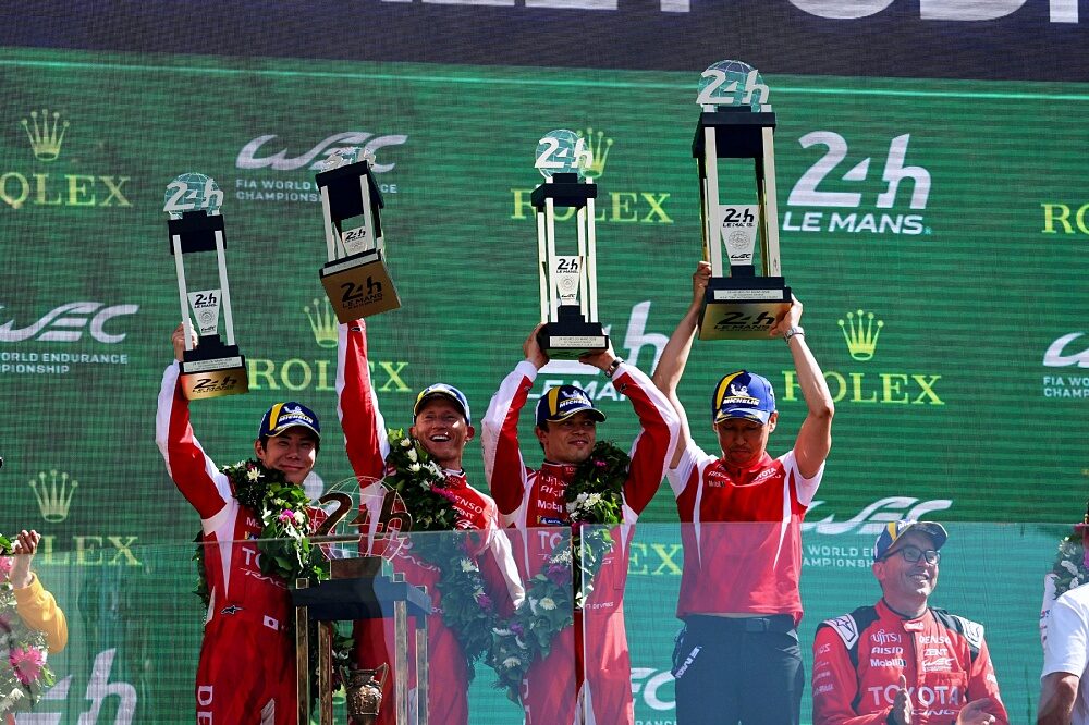 Toyota Racing crew receive trophies on the Le Mans 24 Hours podium