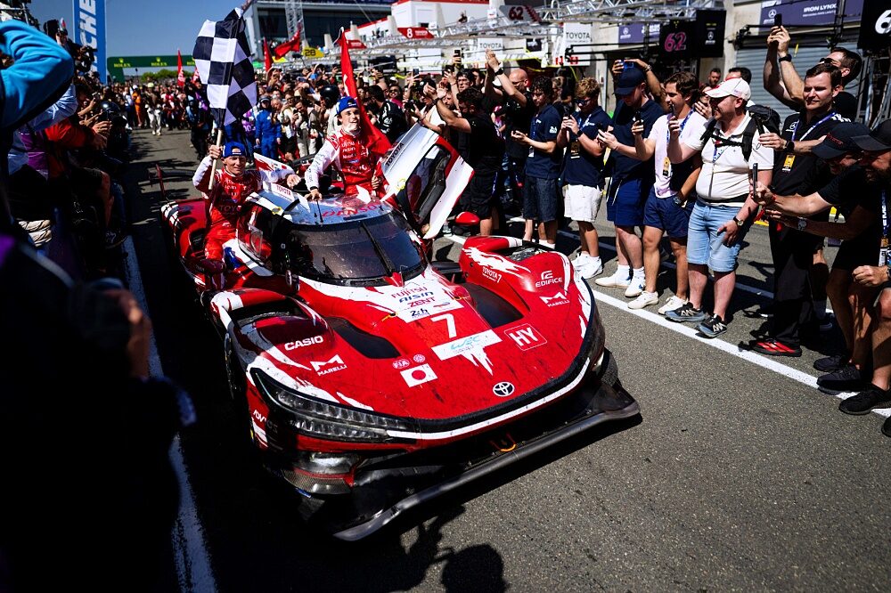 Toyota Racing driver waves from the number 7 TR010 HYBRID
