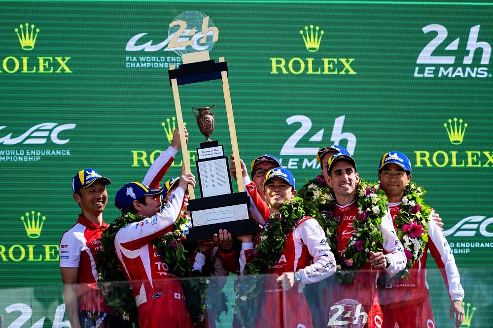 Toyota Racing winners lift trophies on the Le Mans podium