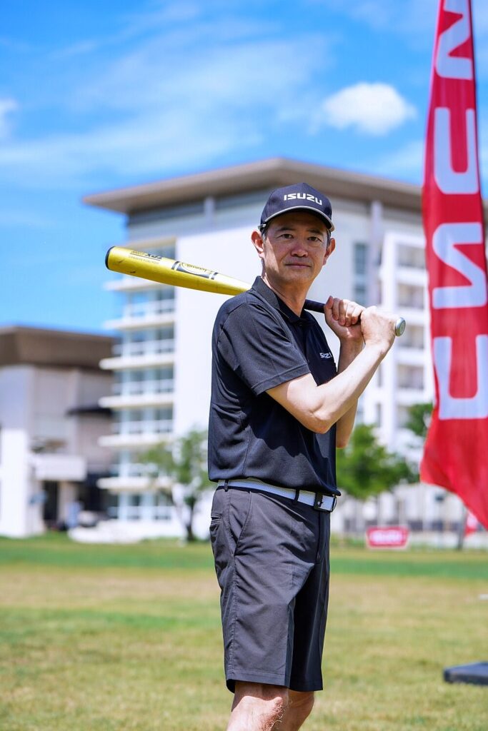 Hiroyasu Sato takes part in the baseball activity