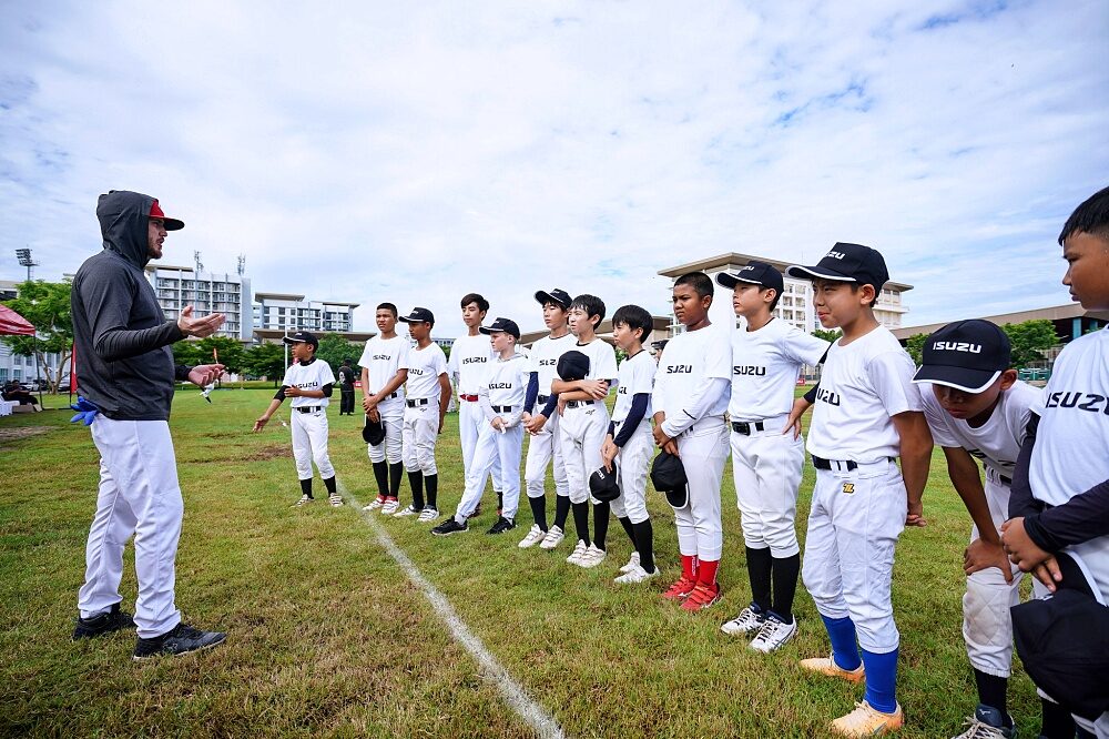 Coach gives instructions to Thailand U12 youth baseball players