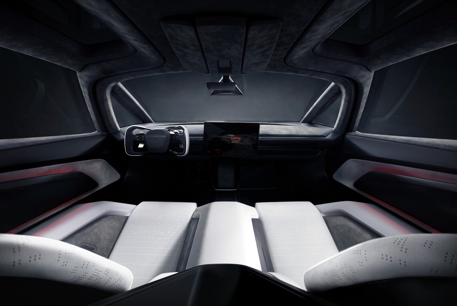 ภาพกว้างห้องโดยสาร Roadster มองจากด้านหลังเบาะไปยังพวงมาลัยและจอ